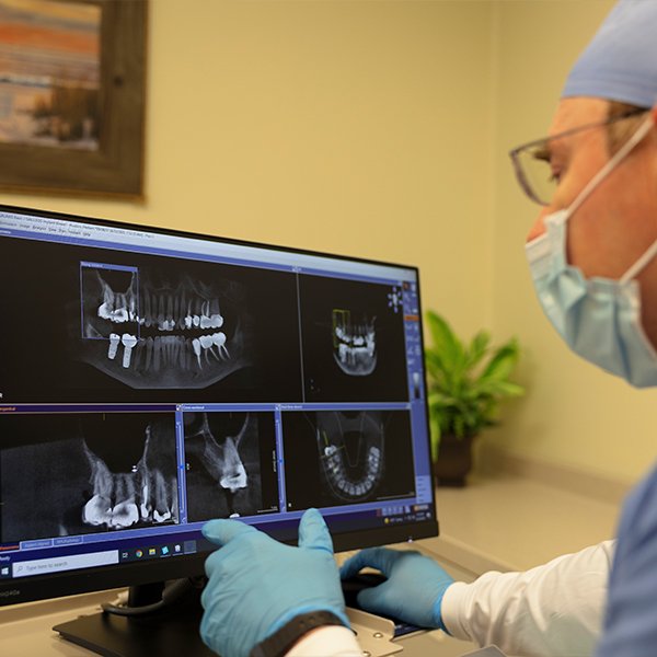 Dentist reviewing all digital x-rays