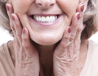 Closeup of patient’s smile with dental implants in Pinehurst