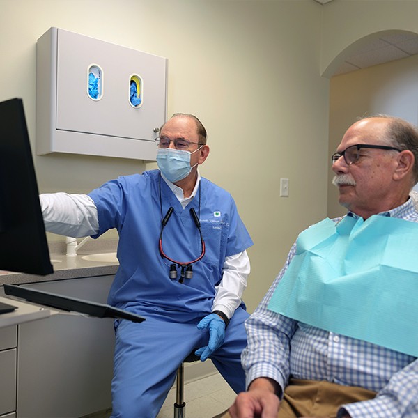 Pinehurst North Carolina dentist Herbert T Hudson D M D P A talking to dental patient