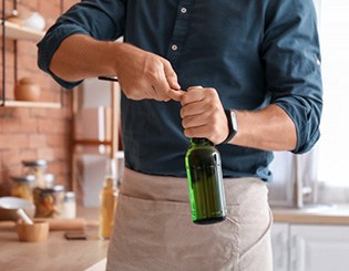 Man uses bottle opener